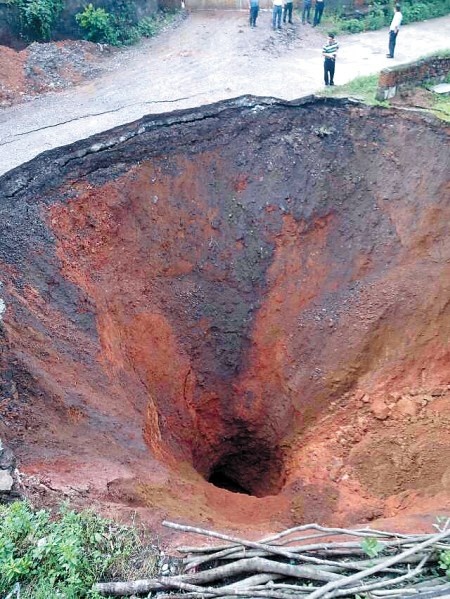 Photo:  Sinkhole depth of 20 meters opened in Ningxiang, Changsha, Hunan, China 2013 5 20